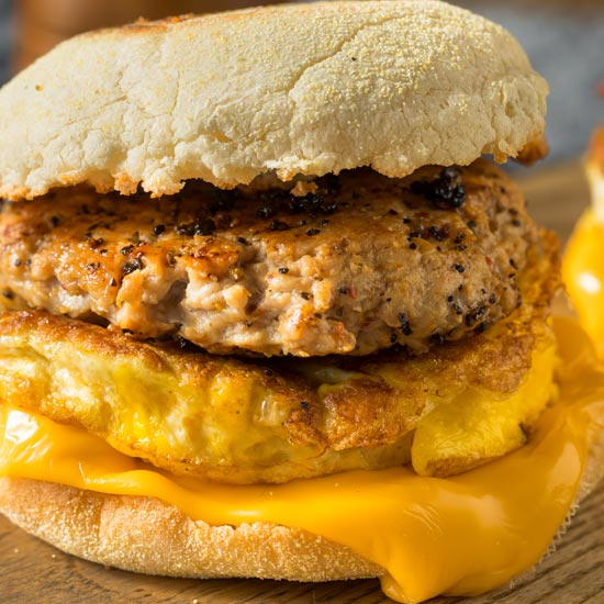 close up of a sausage egg and cheese sandwich