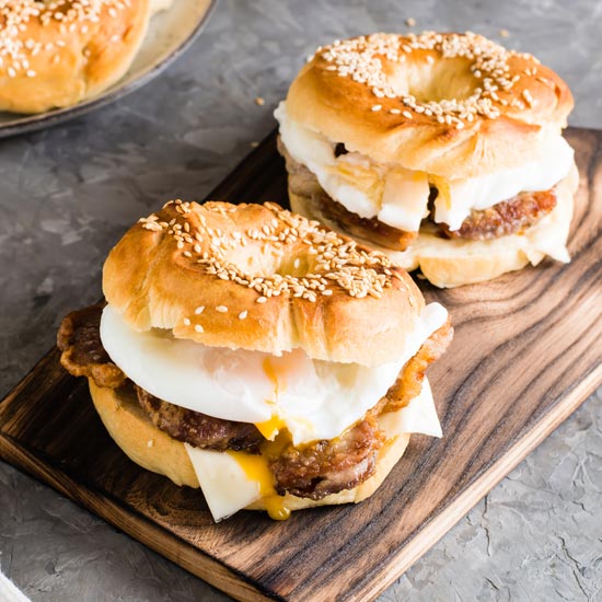 breakfast sandwiches on nice wooden cutting board